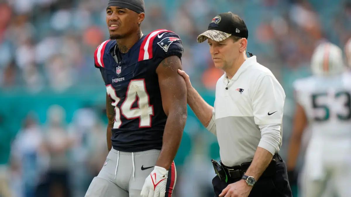 New England Patriots wide receiver Kendrick Bourne (84) leaves the field after being injured during the second half of an NFL football game against the Miami Dolphins, Sunday, Oct. 29, 2023, in Miami Gardens, Fla.